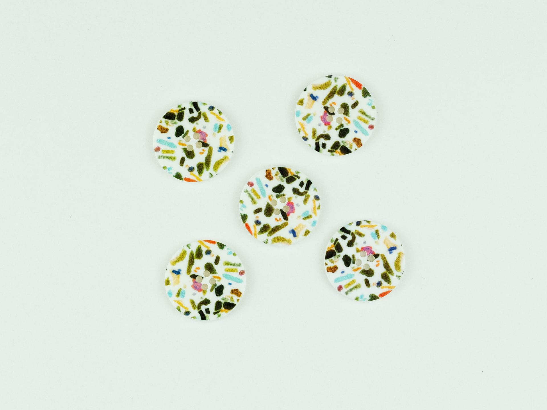 White buttons with speckles